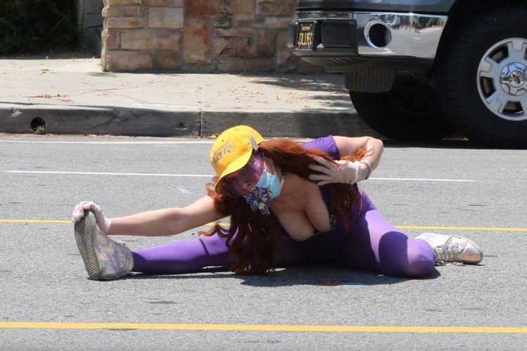 Fitness Freak Phoebe Price Spotted Stretching In The Middle Of The Road