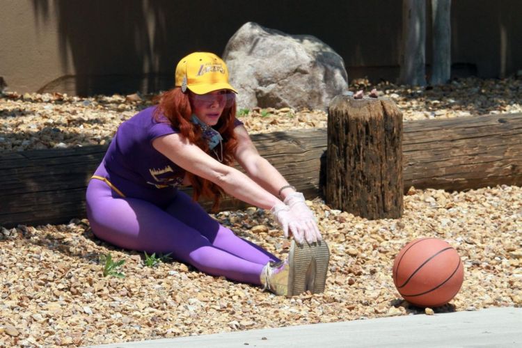 Fitness Freak Phoebe Price Spotted Stretching In The Middle Of The Road