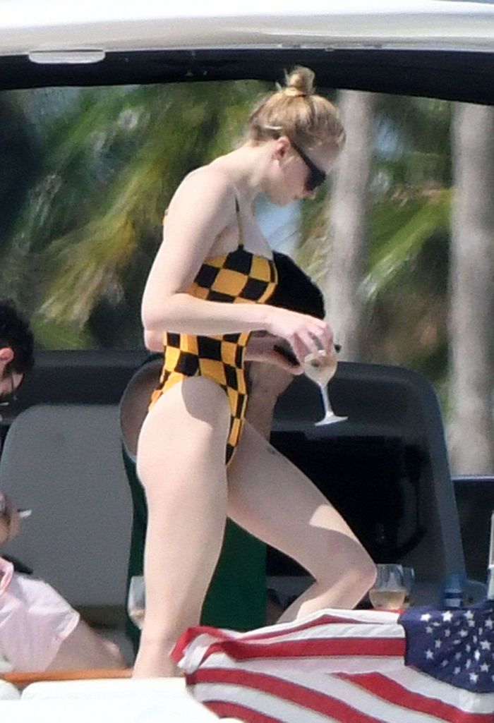 Sophie Turner In A Checkered Swimsuit On A Boat