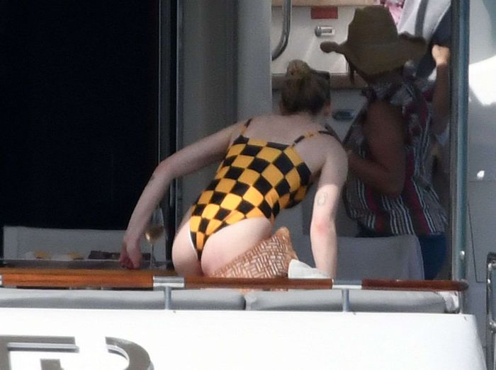 Sophie Turner In A Checkered Swimsuit On A Boat