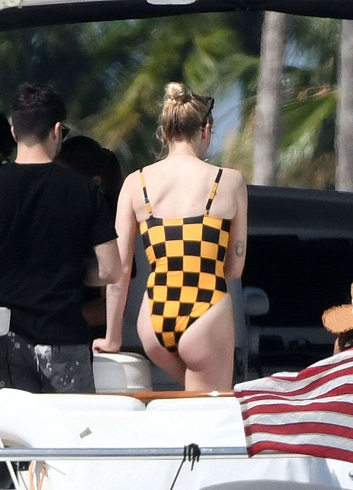 Sophie Turner In A Checkered Swimsuit On A Boat