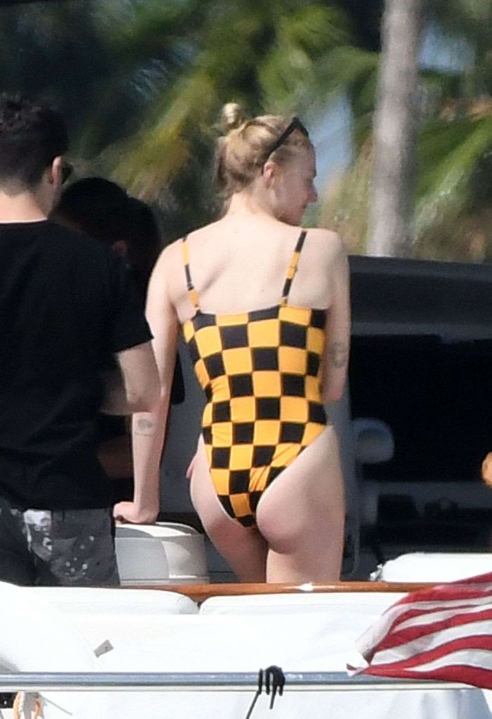 Sophie Turner In A Checkered Swimsuit On A Boat