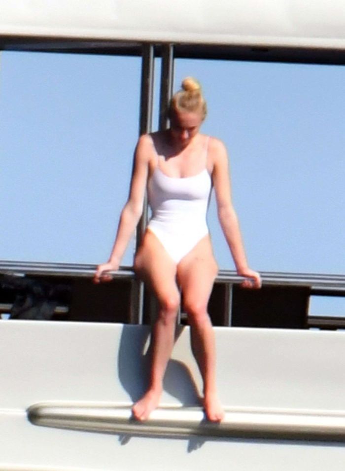 Sophie Turner In A White Swimsuit On A Yacht In Italy