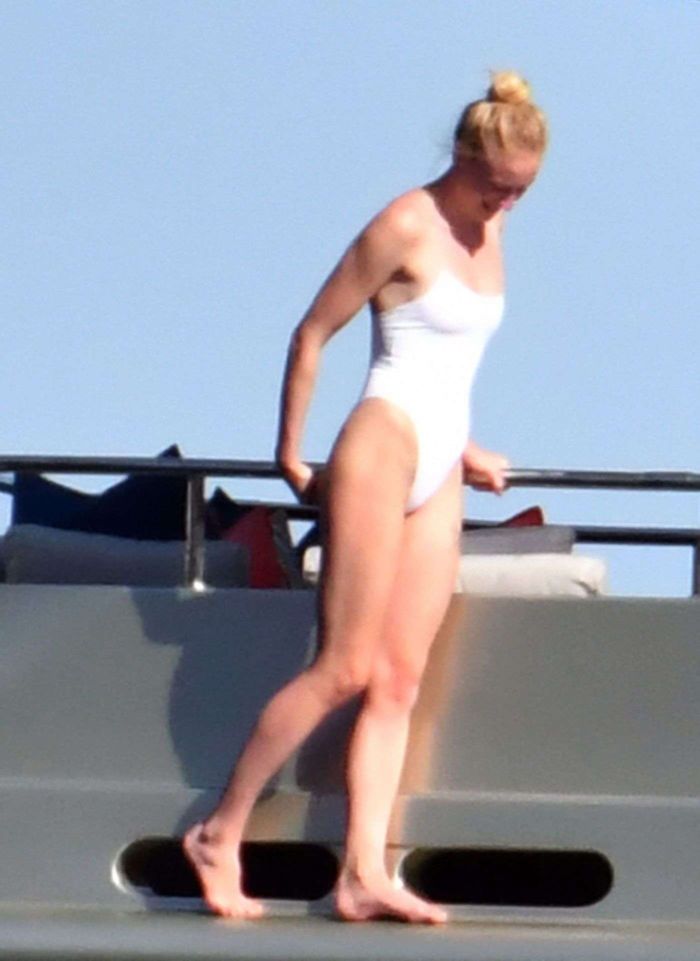 Sophie Turner In A White Swimsuit On A Yacht In Italy