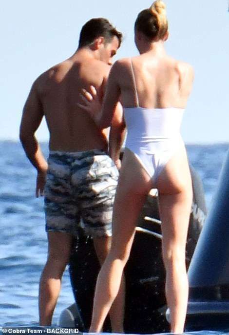 Sophie Turner In A White Swimsuit On A Yacht In Italy