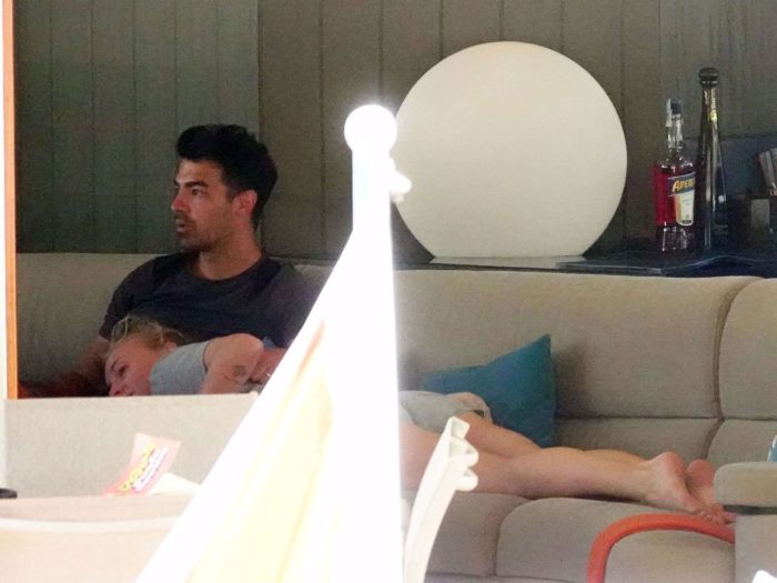 Sophie Turner In A White Swimsuit On A Yacht In Italy