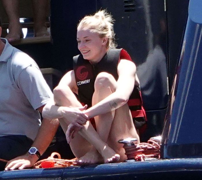 Sophie Turner In A White Swimsuit On A Yacht In Italy
