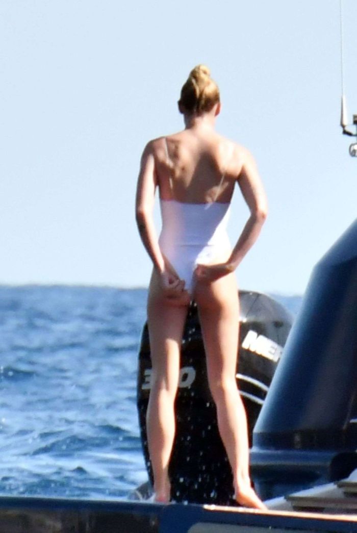Sophie Turner In A White Swimsuit On A Yacht In Italy