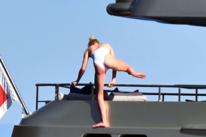 Sophie Turner In A White Swimsuit On A Yacht In Italy