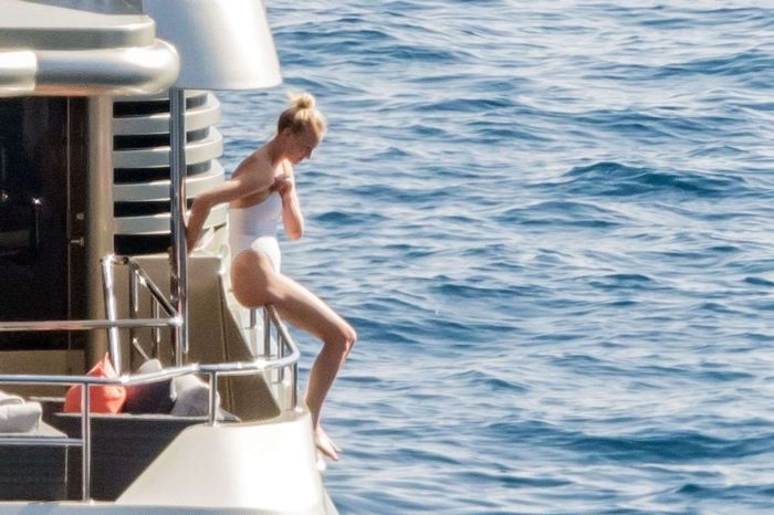 Sophie Turner In A White Swimsuit On A Yacht In Italy