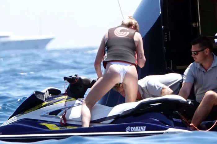 Sophie Turner In A White Swimsuit On A Yacht In Italy
