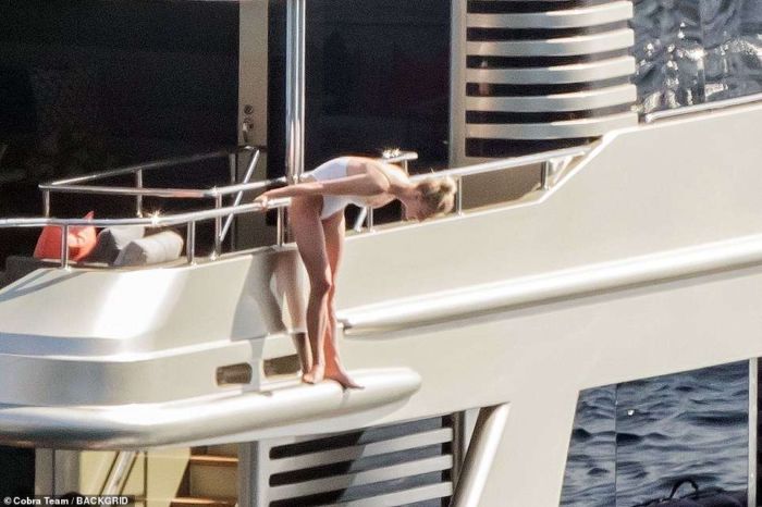 Sophie Turner In A White Swimsuit On A Yacht In Italy
